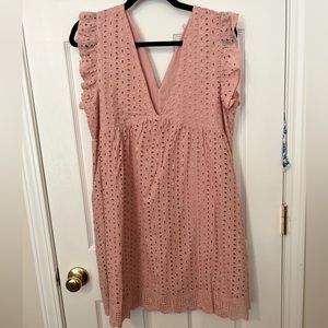 Muted pink v neck eyelit romper with cap sleeves. Never worn. Tags still on